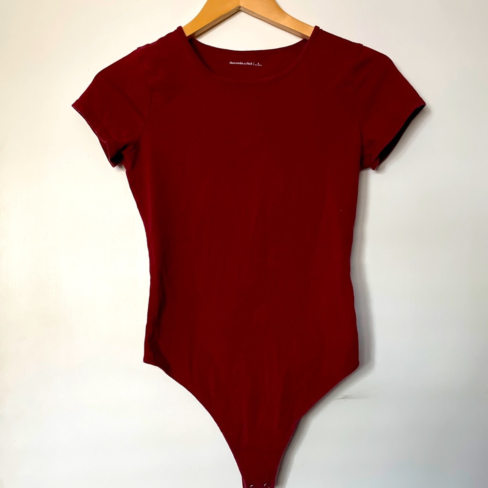 maroon body suit